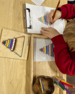Young child working with Montessori Bead Stair