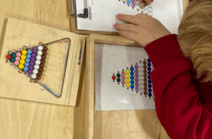 Young child working with Montessori Bead Stair