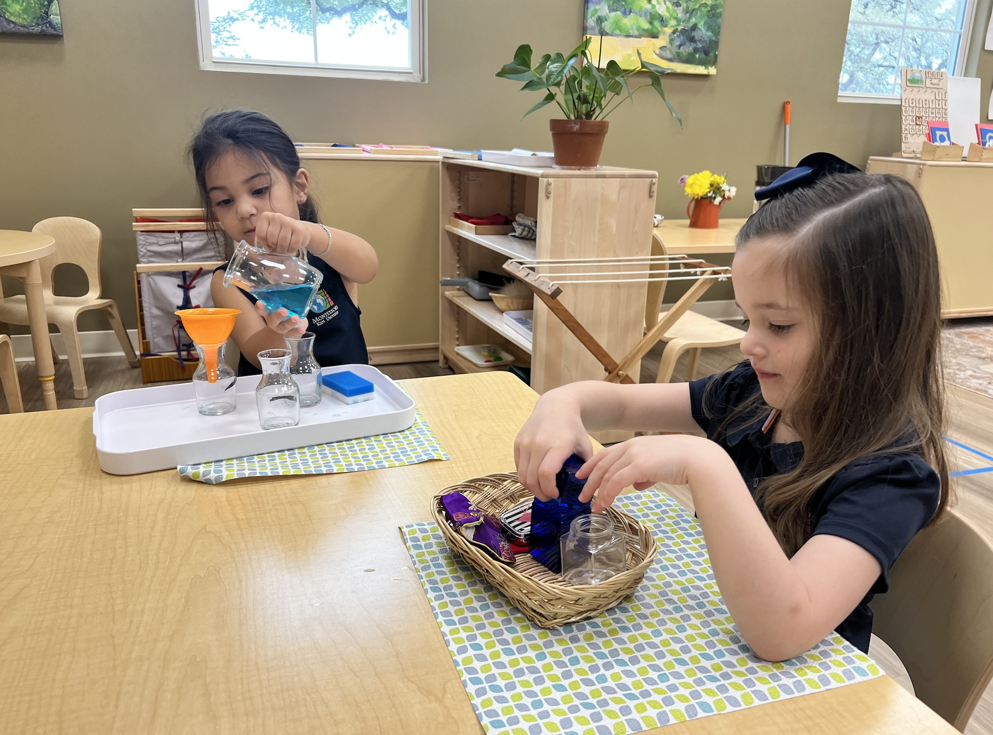 Children working with Montessori materials